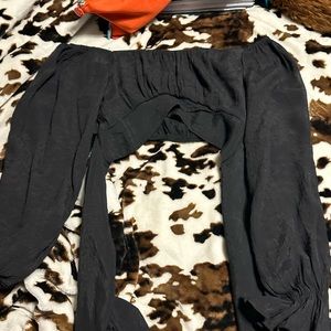 Long sleeve black crop top. Ties in back